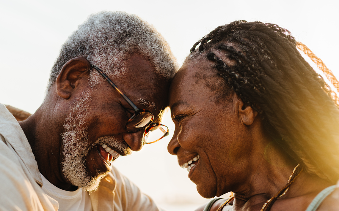 Couple smiling and touching foreheads
